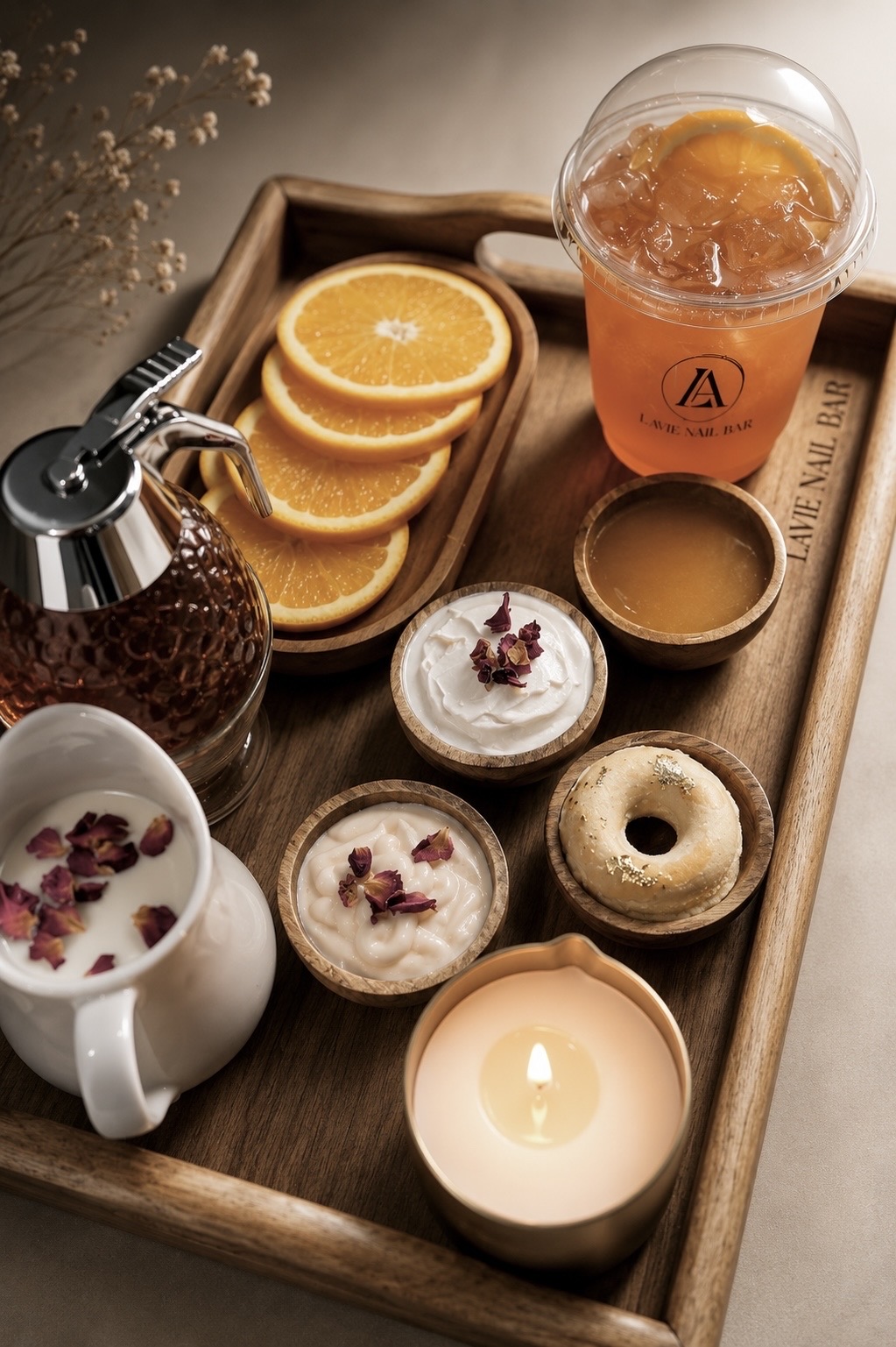 Real Milk & Honey pedicure tray with rose milk, honey, orange slices, and a Lavie Nail Bar signature drink