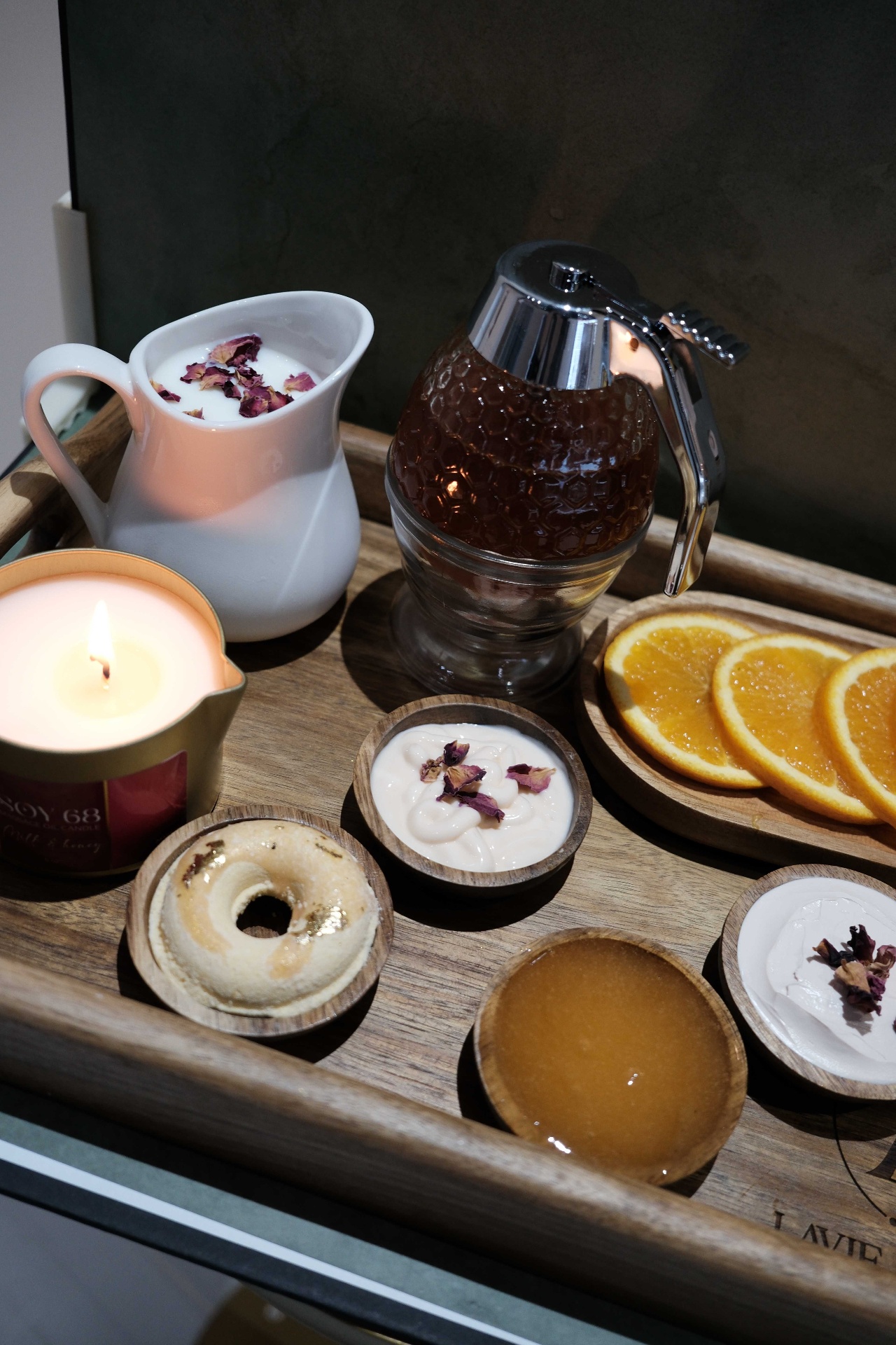 Real Milk & Honey organic pedicure tray with fresh milk, honey, orange slices, and a soy candle