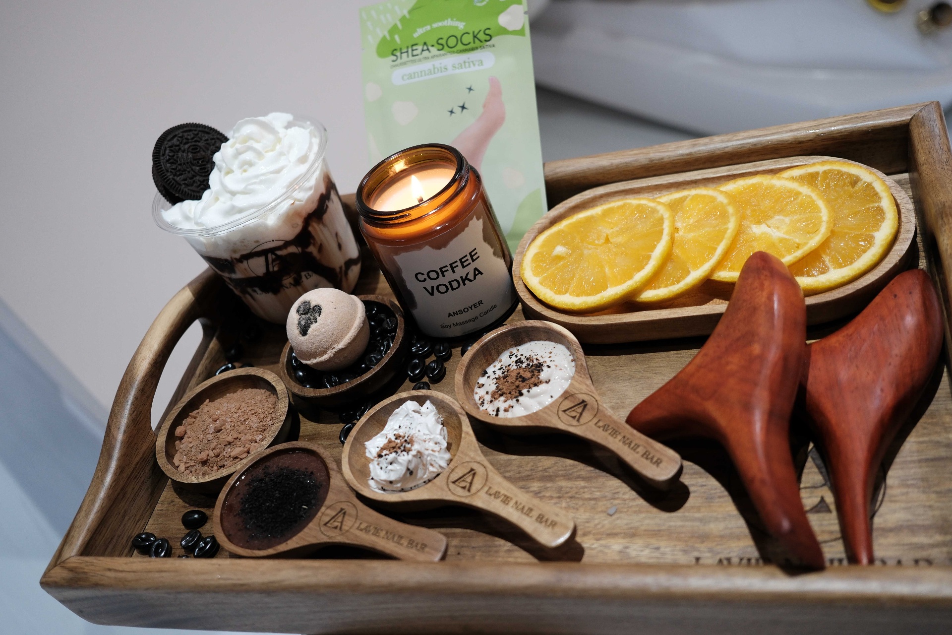 Coffee Vodka luxury pedicure tray with cookies-and-cream shake, coffee scrub, and wooden foot rollers